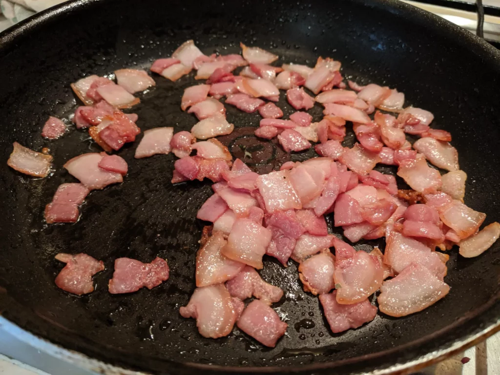 cooking the bacon pieces