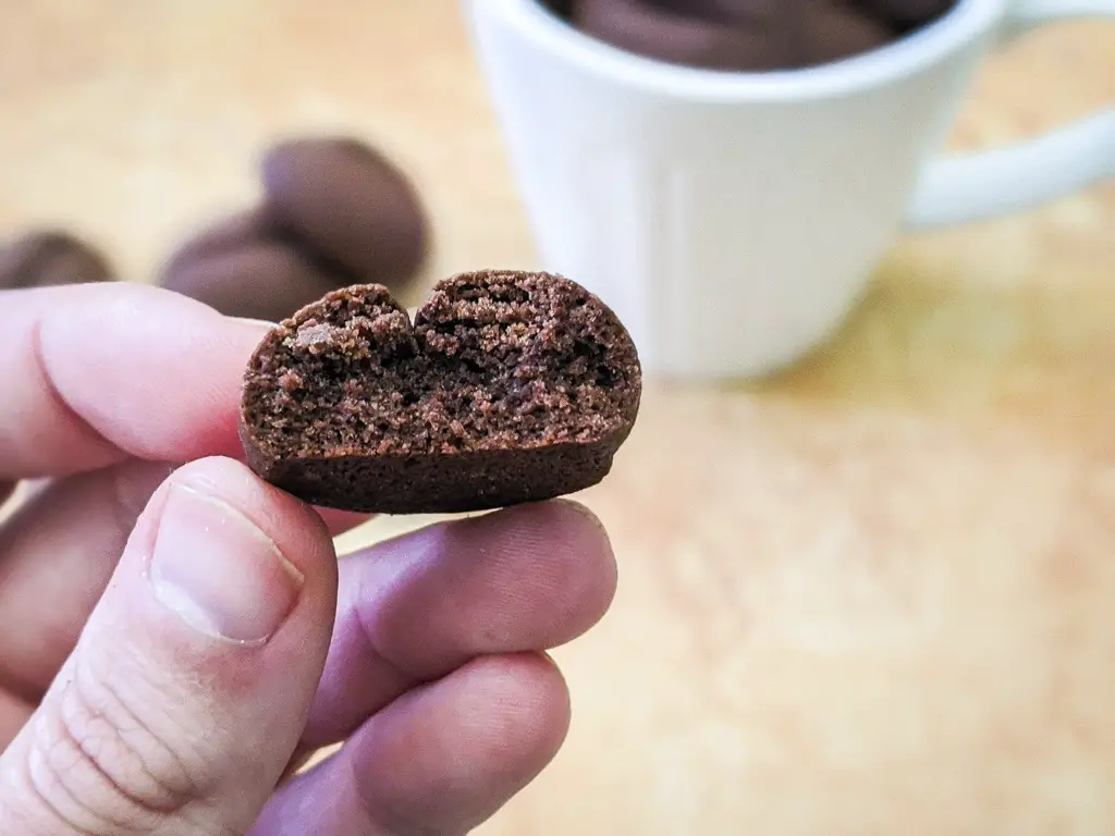 cross section of the coffee bean cookies held by hand