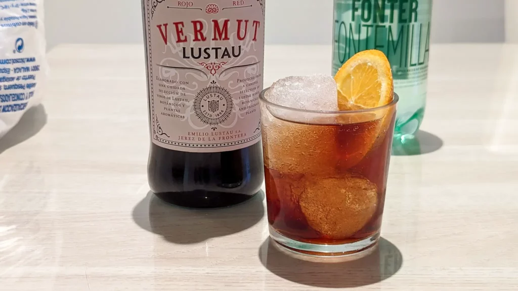 spanish vermouth cocktail with a bottle of vermut rojo and club soda