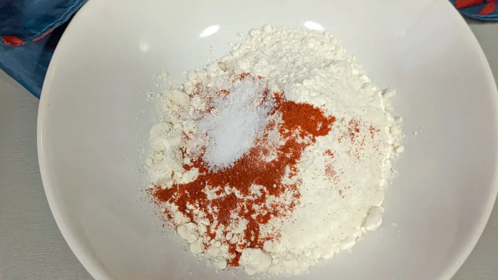 flour salt and paprika in a bowl