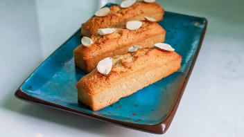 French financiers on a plate with almond sliver garnish
