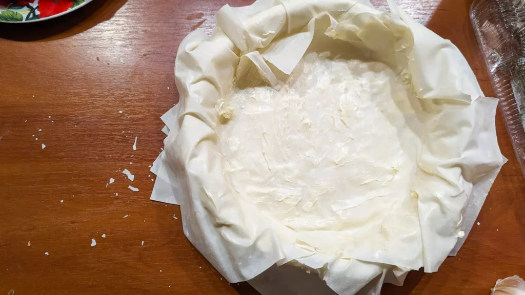 a pie crust made of buttered and flaky phyllo dough