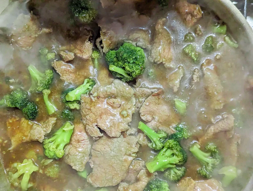 chinese takeout beef and broccoli in a pan