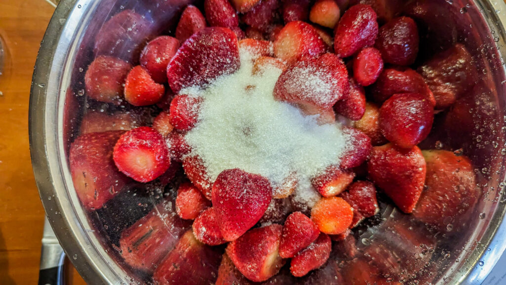 bowl of strawberries with white sugar