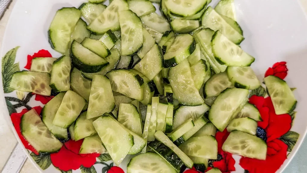 salted cucumber half rounds on a plate